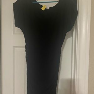 Black fitted dress with thin slits on shoulders
